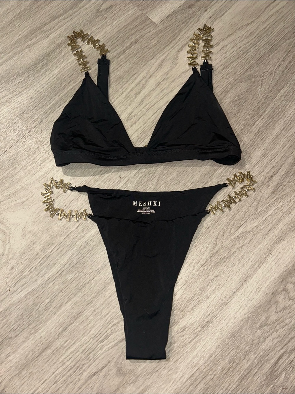 Women’s Meshki black bikini set with gold chain straps detailing Size Medium